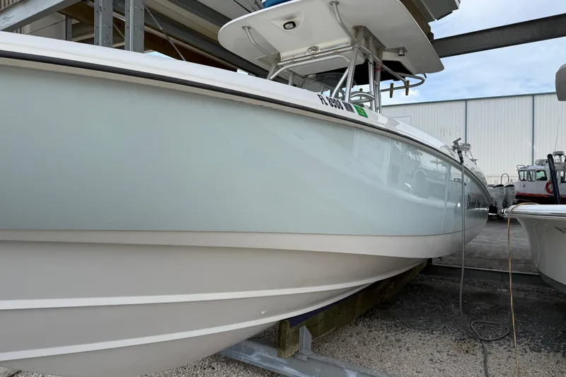 Slide: The Image of 2004 Boston Whaler 320 Outrage boat in storage, side view. - 4