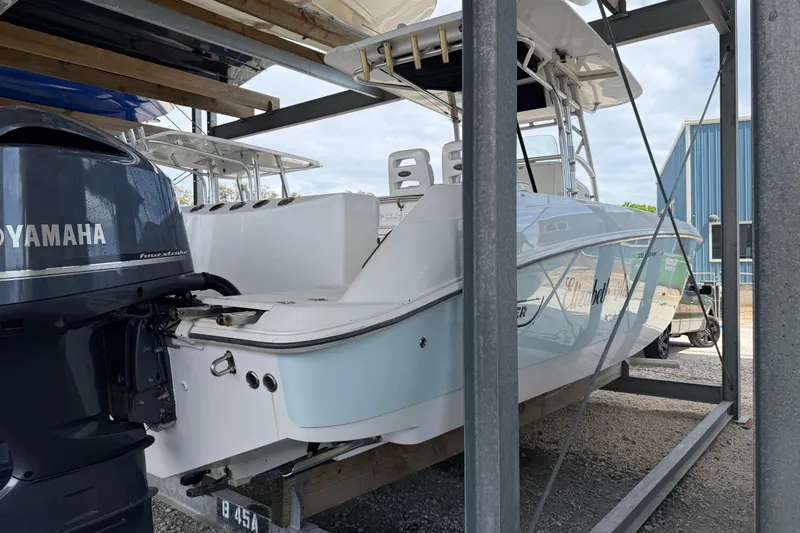 Slide: The Image of 2004 Boston Whaler 320 Outrage boat with Yamaha engine in storage. - 7
