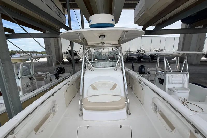 Slide: The Image of 2004 Boston Whaler 320 Outrage boat docked in a marina storage facility. - 8