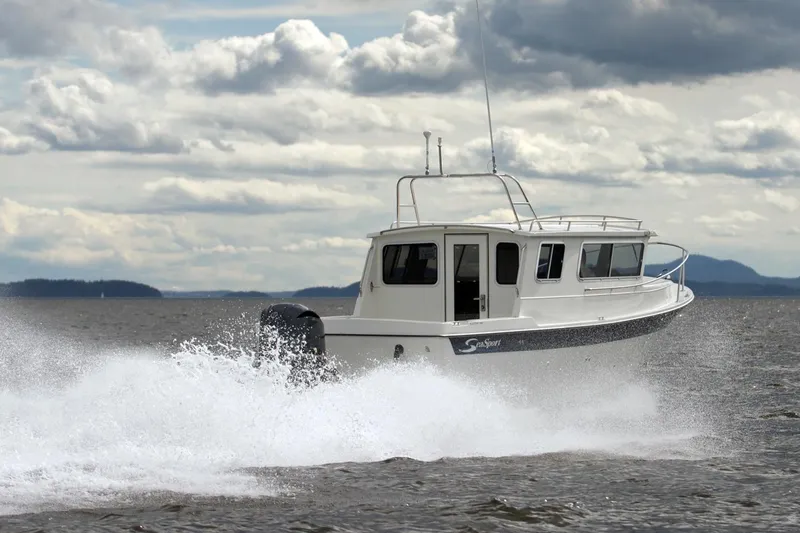 The Image of 2026 SeaSport Aleutian 2600 cruising on open water under cloudy skies. - 1
