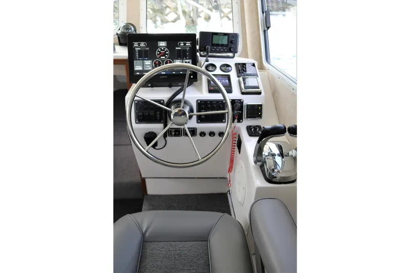 Slide: The Image of 2026 SeaSport Aleutian 2600 helm with modern controls and navigation equipment. - 10