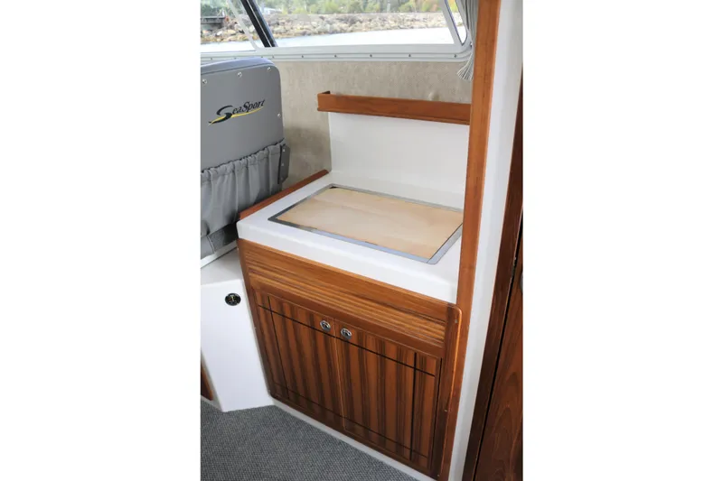 Slide: The Image of Interior of 2026 SeaSport Aleutian 2600 boat with wooden cabinetry and countertop. - 12