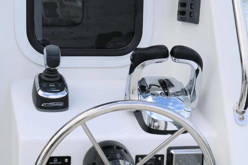 Slide: The Image of Control panel of 2026 SeaSport Aleutian 2600 boat with joystick and throttle levers. - 17