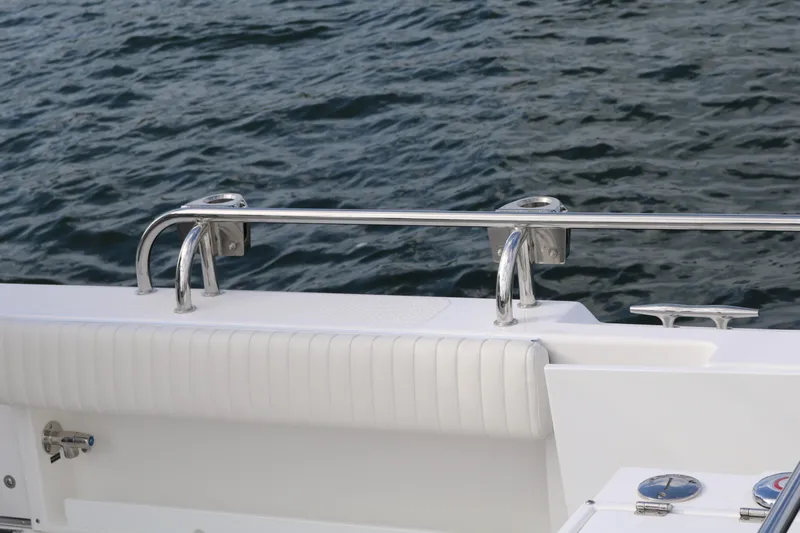 Slide: The Image of 2026 SeaSport Aleutian 2600 boat railing and seating detail by the water. - 20