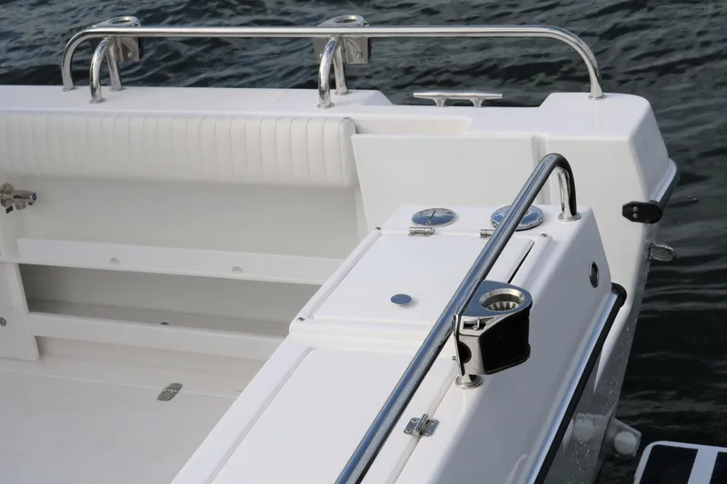 Slide: The Image of 2026 SeaSport Aleutian 2600 boat deck with stainless steel railings and seating. - 28