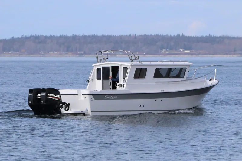 Slide: The Image of 2026 SeaSport Aleutian 2600 boat cruising on calm waters with twin Mercury engines. - 5