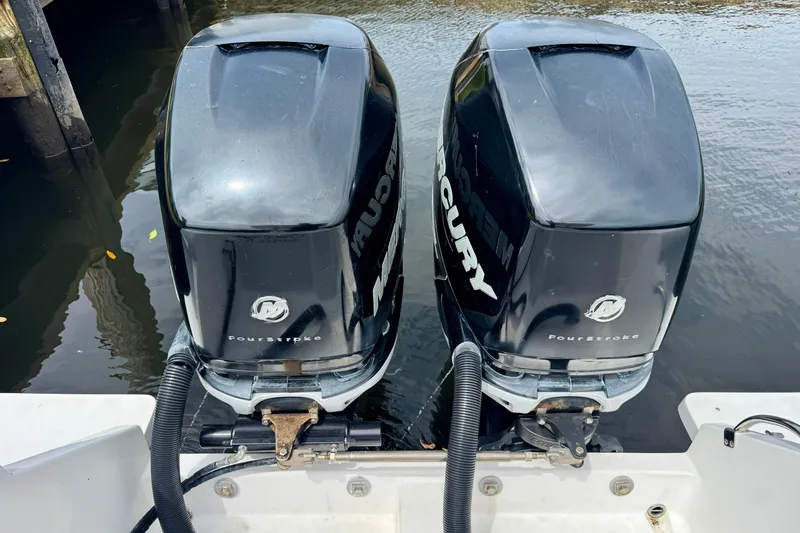 Slide: The Image of Twin Mercury FourStroke engines on a 2013 Intrepid 300 Center Console boat. - 11