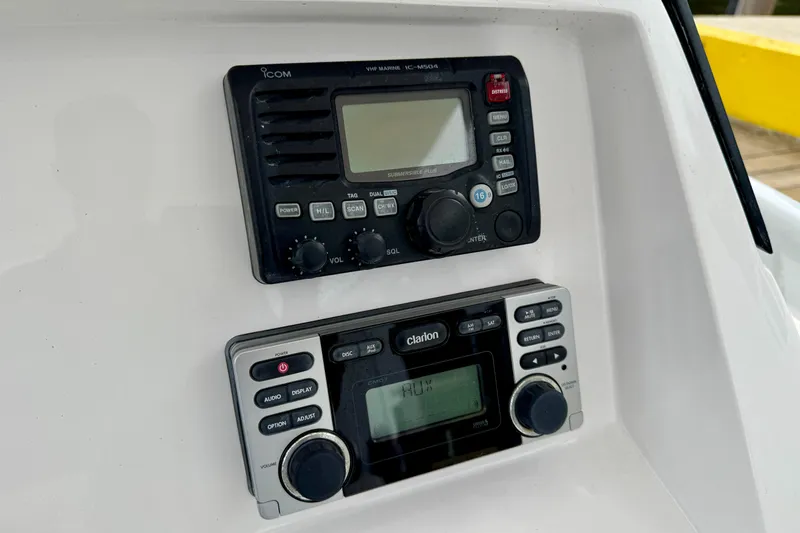 Slide: The Image of Control panel of a 2013 Intrepid 300 Center Console boat with radio equipment. - 17