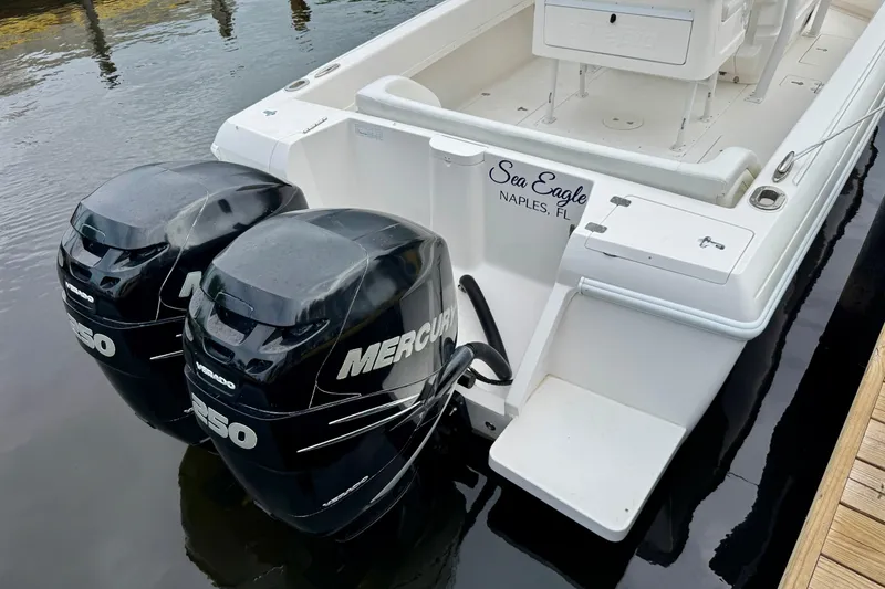 Slide: The Image of 2013 Intrepid 300 Center Console boat with twin Mercury 250 engines docked in Naples, FL. - 23