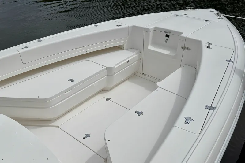 Slide: The Image of 2013 Intrepid 300 Center Console boat interior with seating and storage compartments. - 4
