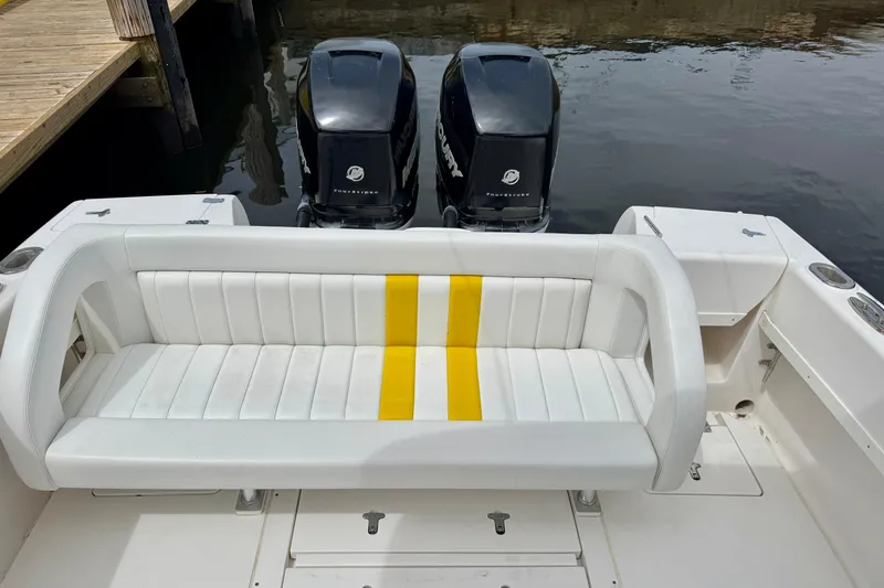Slide: The Image of 2013 Intrepid 300 Center Console boat with dual Mercury engines and white seating. - 7