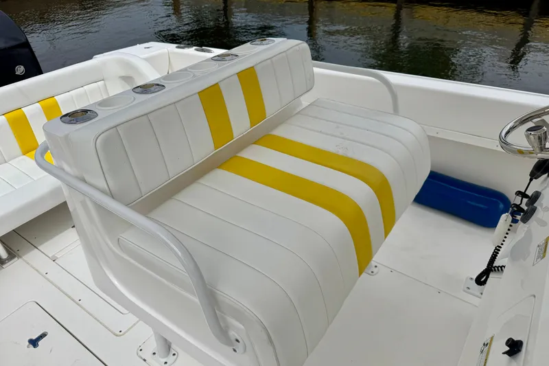 Slide: The Image of 2013 Intrepid 300 Center Console boat with white and yellow seating. - 8
