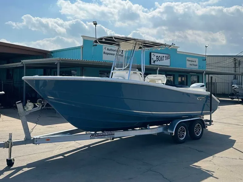 The Image of 2026 Bulls Bay 230 Center Console boat on trailer outside workshop. - 1