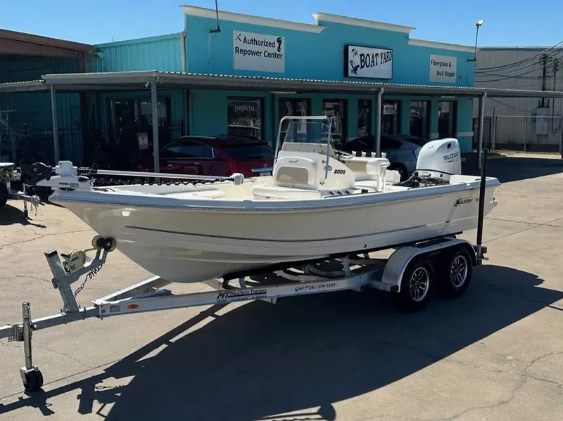 The Image of 2026 Bulls Bay 2000 boat on trailer outside repair shop. - 1