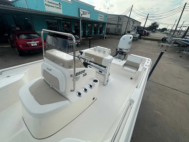 Slide: The Image of Bulls Bay 2200 XS boat 2026 on a parking lot outside a shop. - 17