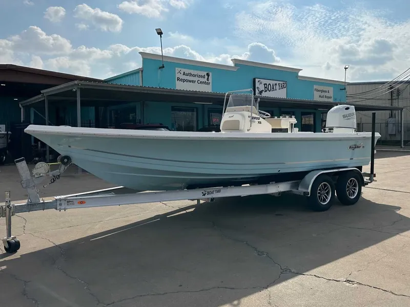 Slide: The Image of 2026 Bulls Bay 2200 XS boat on trailer outside workshop. - 8