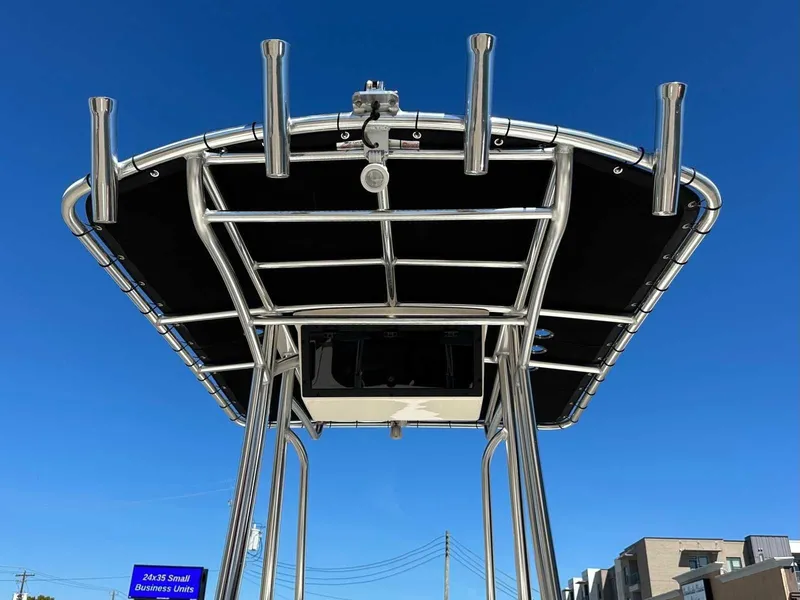Slide: The Image of Bulls Bay 2200 XS 2026 boat top with rod holders, blue sky. - 23