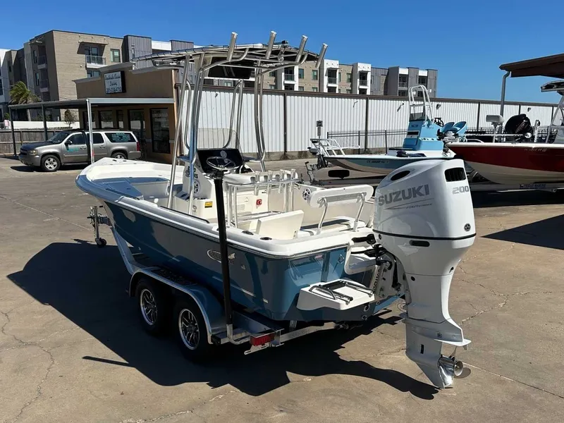 Slide: The Image of 2026 Bulls Bay 2200 XS boat with Suzuki engine outdoors. - 3