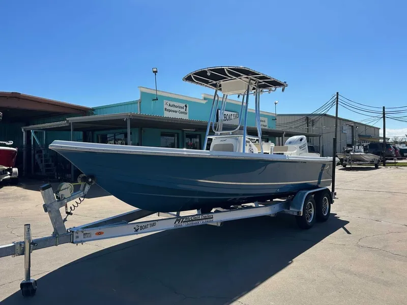 Slide: The Image of 2026 Bulls Bay 2200 XS boat on trailer outside workshop. - 8