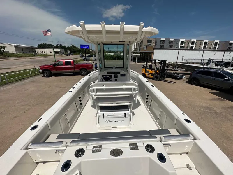 Slide: The Image of 2026 Sailfish 232 CC boat on a sunny parking lot. - 12