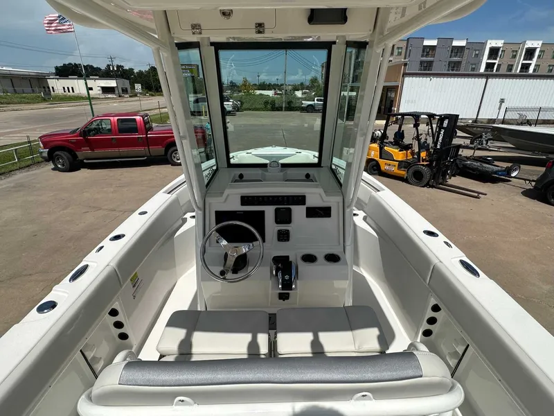 Slide: The Image of Interior view of 2026 Sailfish 232 CC boat, helm and seating visible. - 18