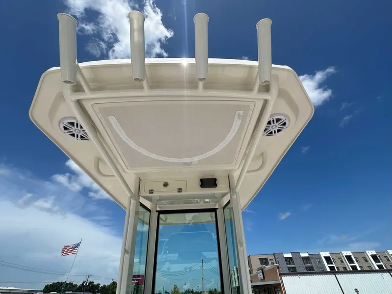 Slide: The Image of Sailfish 232 CC 2026 boat roof with rod holders and speakers. - 19