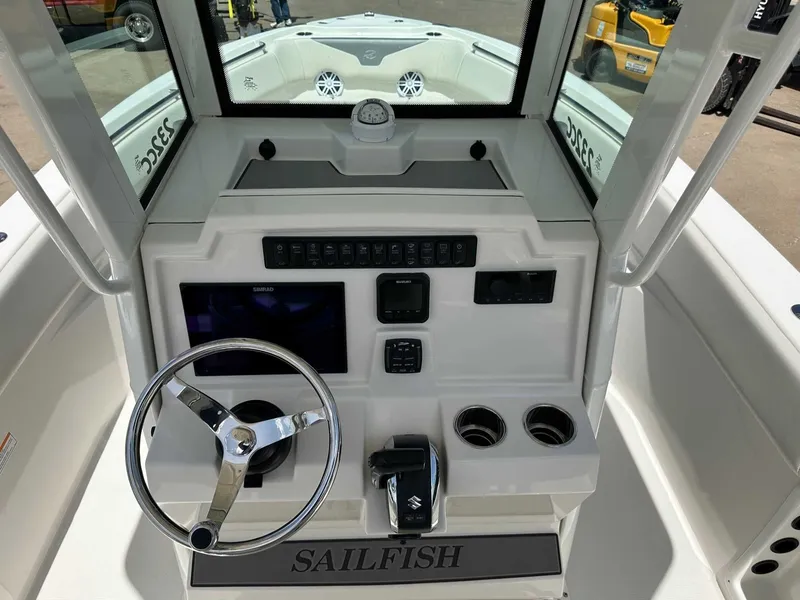 Slide: The Image of 2026 Sailfish 232 CC helm with steering wheel and controls. - 20