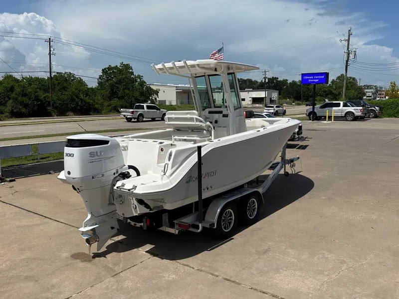 Slide: The Image of 2026 Sailfish 232 CC boat on trailer, Suzuki engine, sunny day. - 5