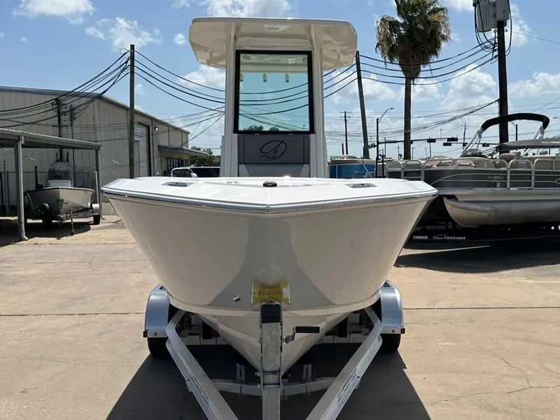 Slide: The Image of 2026 Sailfish 232 CC boat on trailer outdoors. - 8