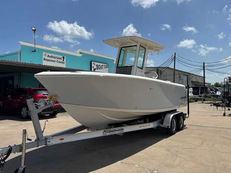 Slide: The Image of 2026 Sailfish 232 CC boat on trailer in sunny weather. - 9