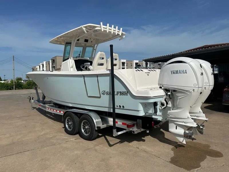 Slide: The Image of 2026 Sailfish 272 CC boat with Yamaha engines on trailer. - 11