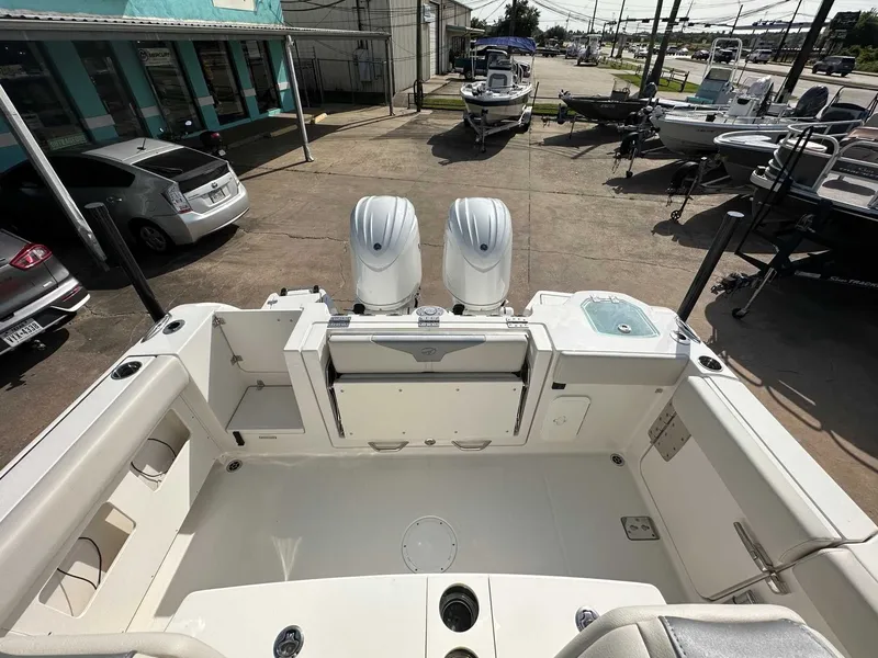 Slide: The Image of Sailfish 272 CC 2026 with twin outboard engines on a parking lot. - 16