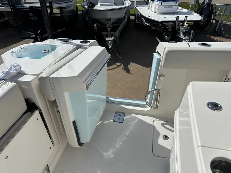 Slide: The Image of Sailfish 272 CC 2026 boat with open door and deck view. - 19