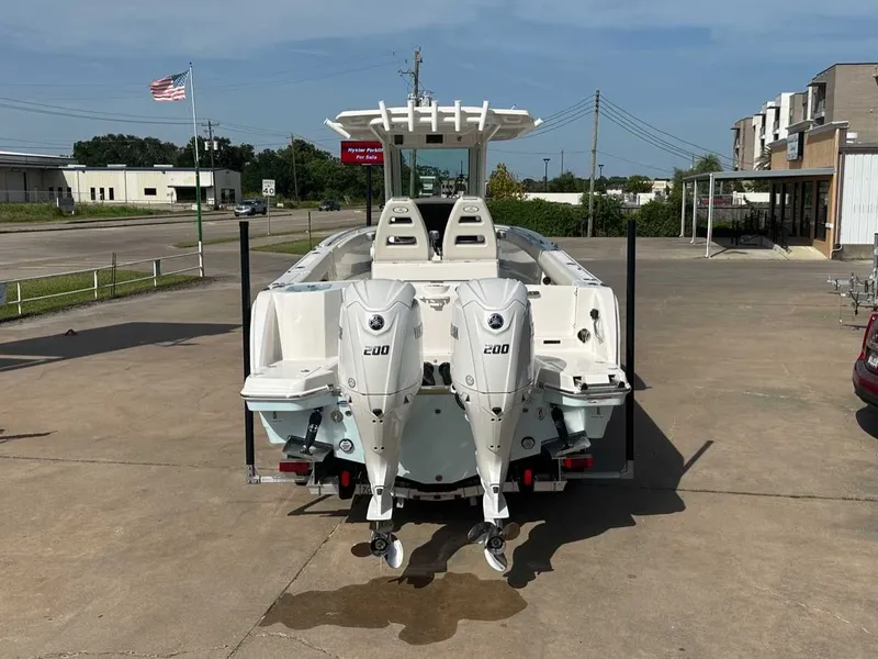 Slide: The Image of Sailfish 272 CC 2026 with twin outboard engines on a parking lot. - 4