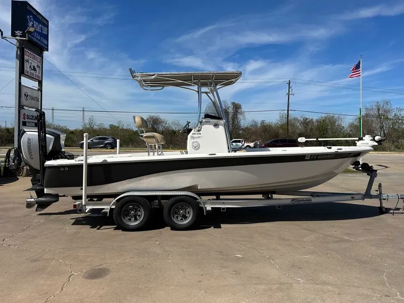 Slide: The Image of 2019 NauticStar 227XTS boat on trailer, side view. - 13