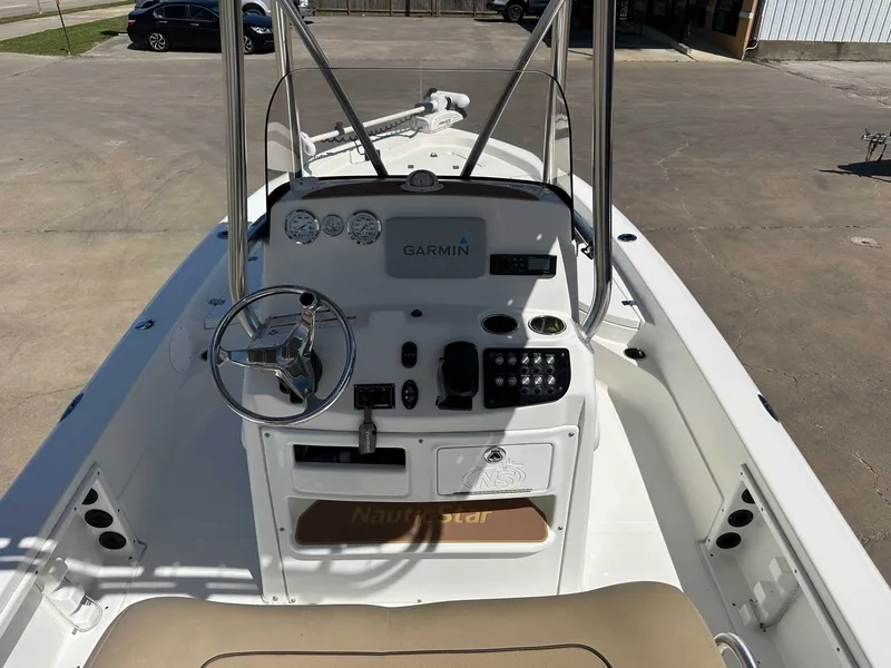 Slide: The Image of Interior view of 2019 NauticStar 227XTS boat with helm console. - 15