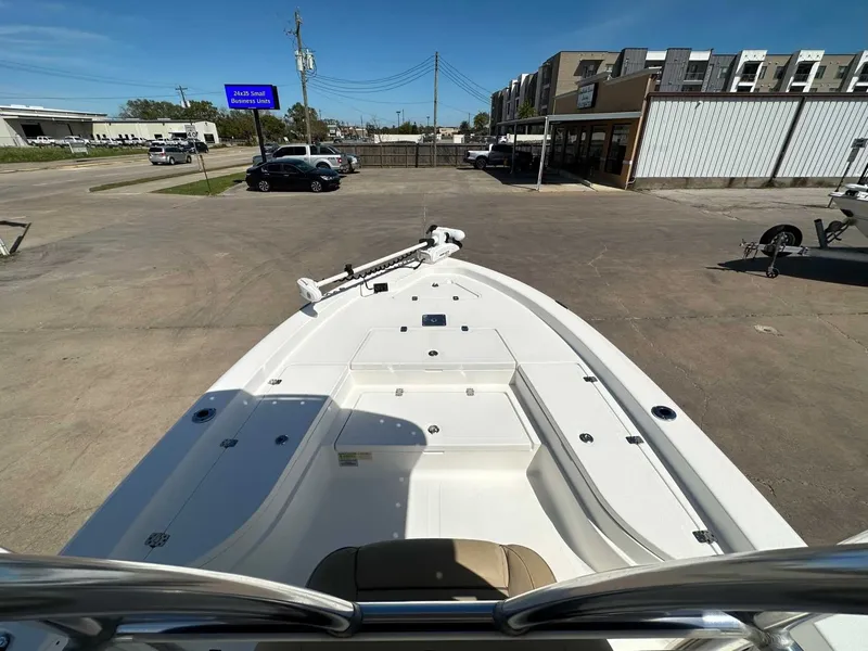 Slide: The Image of 2019 NauticStar 227XTS boat displayed in parking lot. - 17
