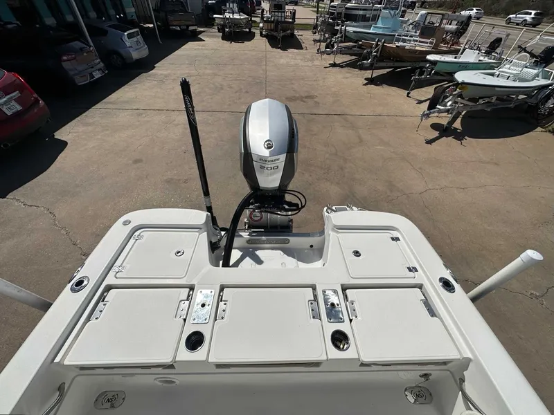 Slide: The Image of 2019 NauticStar 227XTS boat with outboard motor on parking lot. - 21