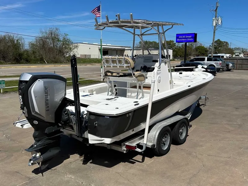 Slide: The Image of 2019 NauticStar 227XTS boat with Evinrude motor on trailer. - 5