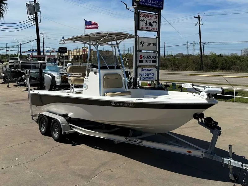 Slide: The Image of 2019 NauticStar 227XTS boat on trailer outdoors. - 6