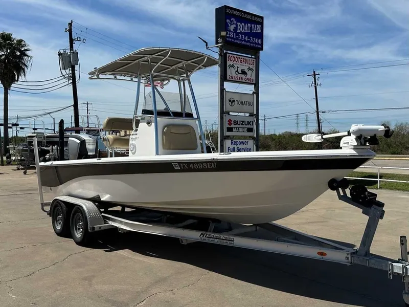 Slide: The Image of 2019 NauticStar 227XTS boat on trailer outdoors. - 7