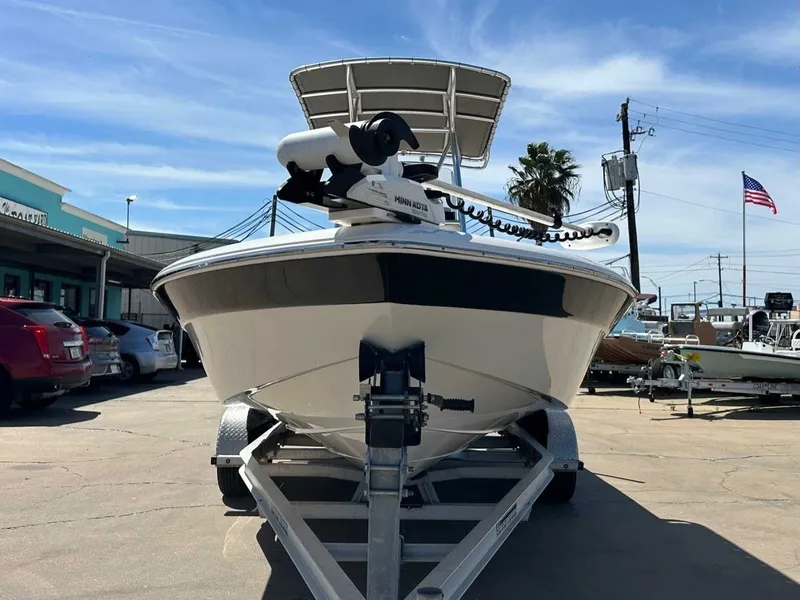 Slide: The Image of 2019 NauticStar 227XTS boat on trailer, blue sky. - 8