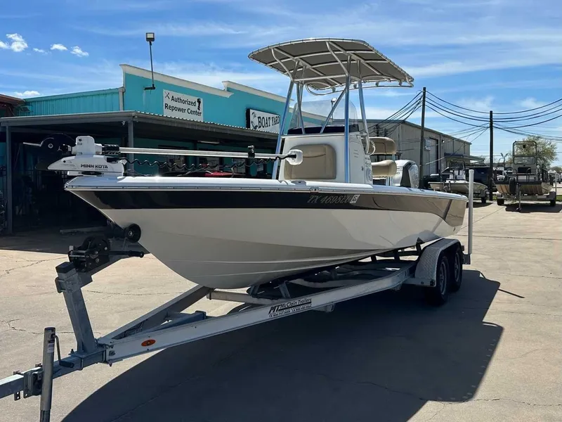 Slide: The Image of 2019 NauticStar 227XTS boat on trailer outside workshop. - 9