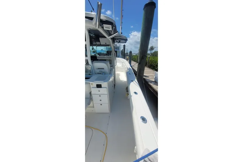 Slide: The Image of Luxury seating on 2009 Everglades 350 Center Console boat, featuring white cushioned seats. - 10