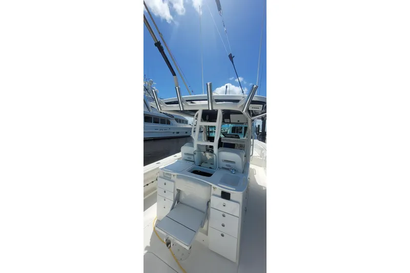 Slide: The Image of Storage compartment with blue ropes on a 2009 Everglades 350 Center Console boat. - 11