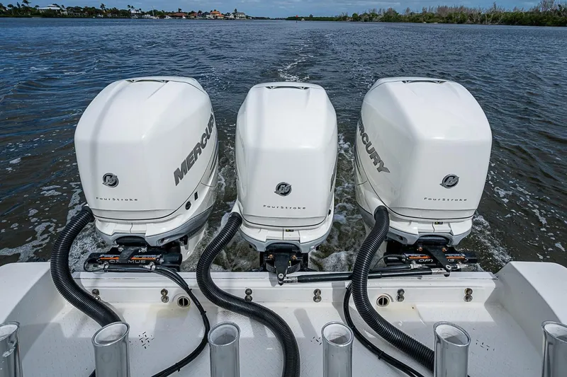 Slide: The Image of Triple Mercury outboard engines on a 2009 Everglades 350 Center Console boat. - 23