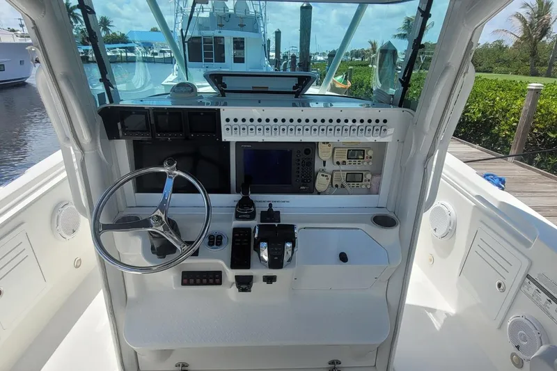 Slide: The Image of Front view of a 2009 Everglades 350 Center Console boat on water. - 3