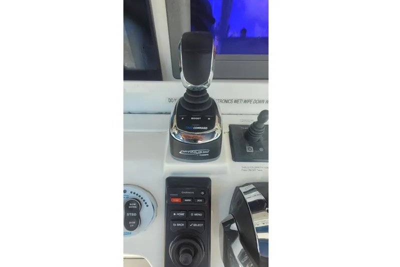 Slide: The Image of 2009 Everglades 350 Center Console boat interior with fishing rod holders and seating. - 6