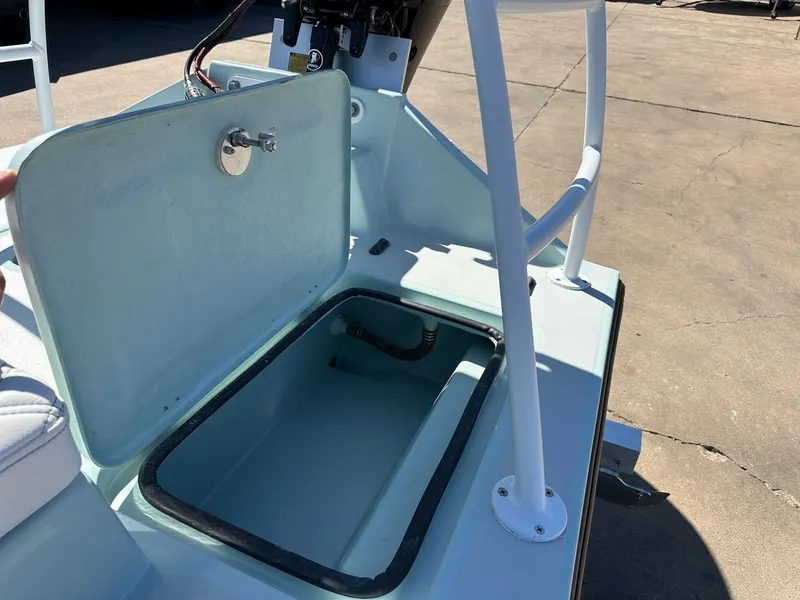 Slide: The Image of Open storage compartment on B & D Boat Works Wasp 178 Tiller, 2026 model. - 17