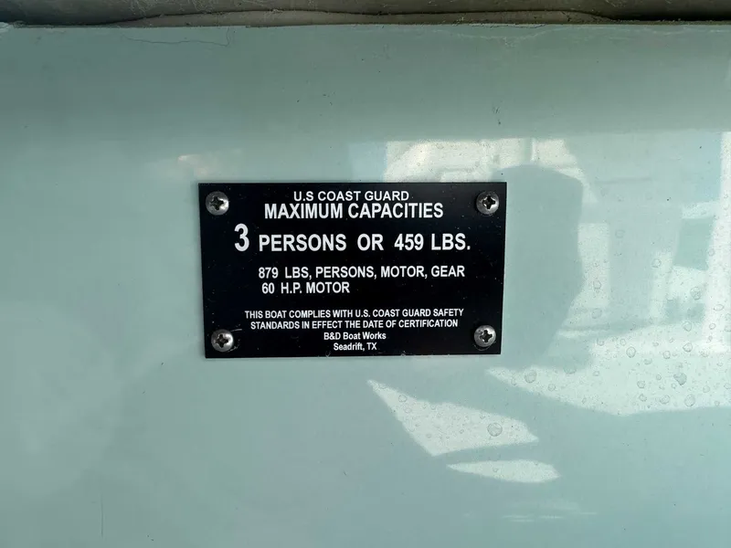 Slide: The Image of USCG capacity plate on B & D Boat Works Wasp 178 Tiller. - 20
